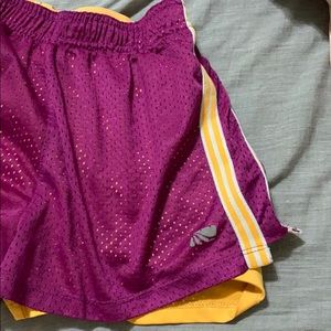 purple and orange athletic shorts